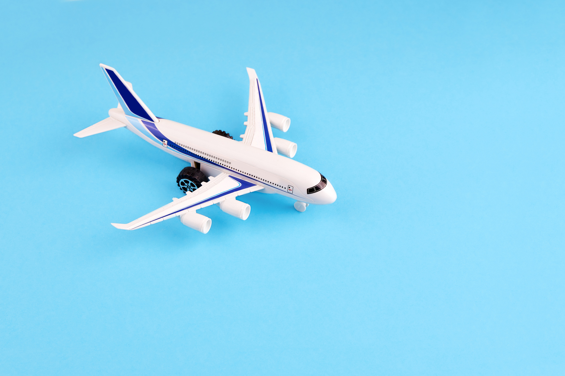 Airplane toy on blue background.